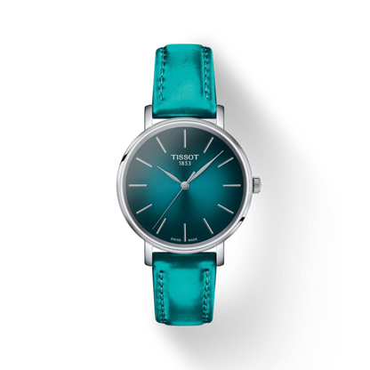 Tissot watch with teal leather strap on a white background