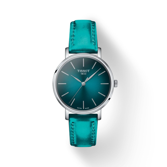 Tissot watch with teal leather strap on a white background