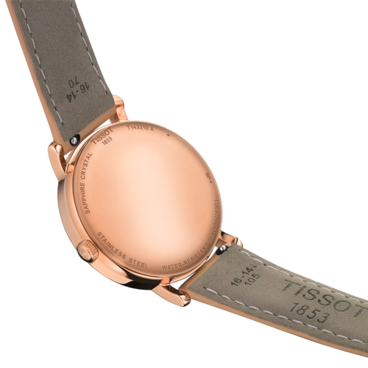 Close-up of a Tissot watch with rose gold case and gray leather strap on a white background