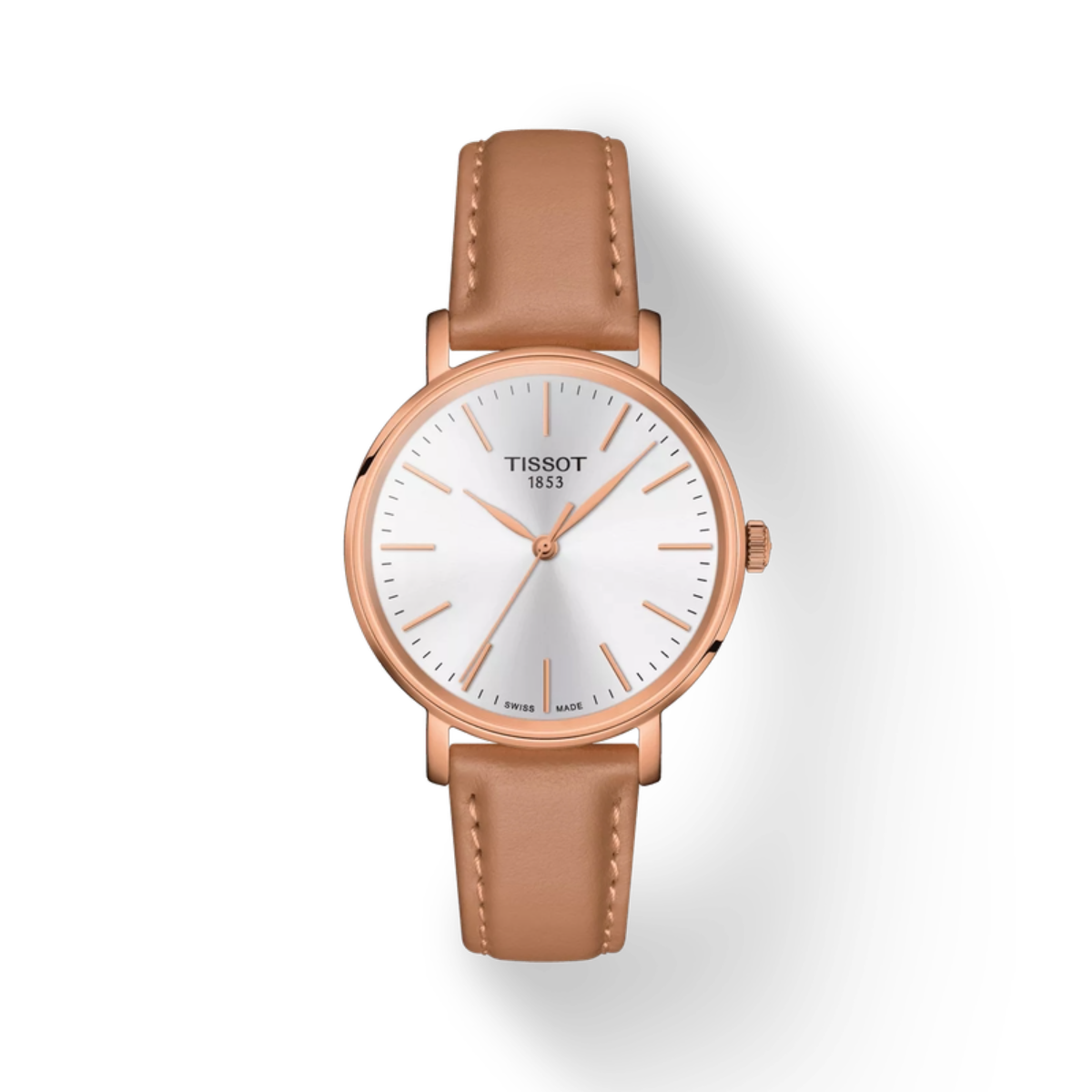 Tissot watch with brown leather strap and rose gold case on white background