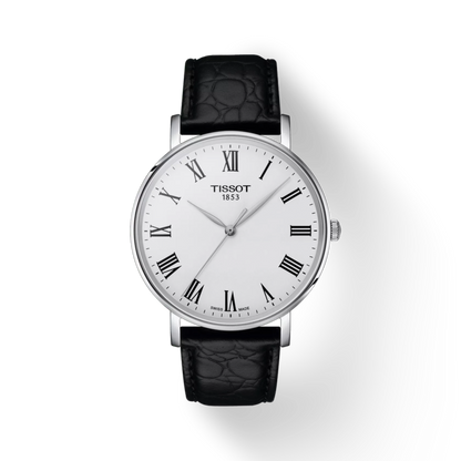 Tissot watch with black leather strap on a white background