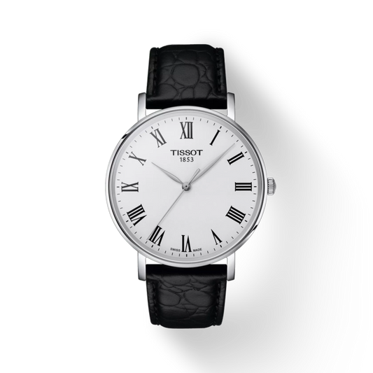 Tissot watch with black leather strap on a white background