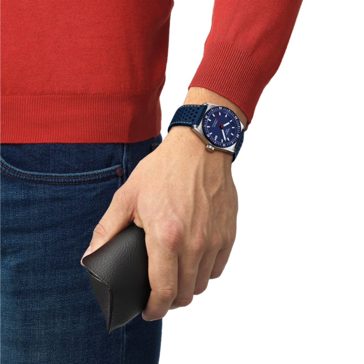 Person wearing a red sweater and blue jeans with a blue watch on a white background