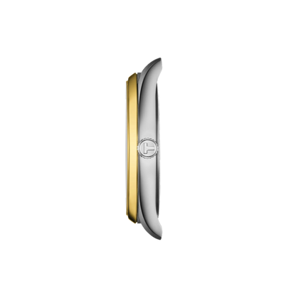 Two-tone watch case with gold and silver finish on a white background