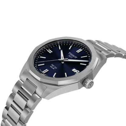 Silver Tissot watch with blue dial on a white background