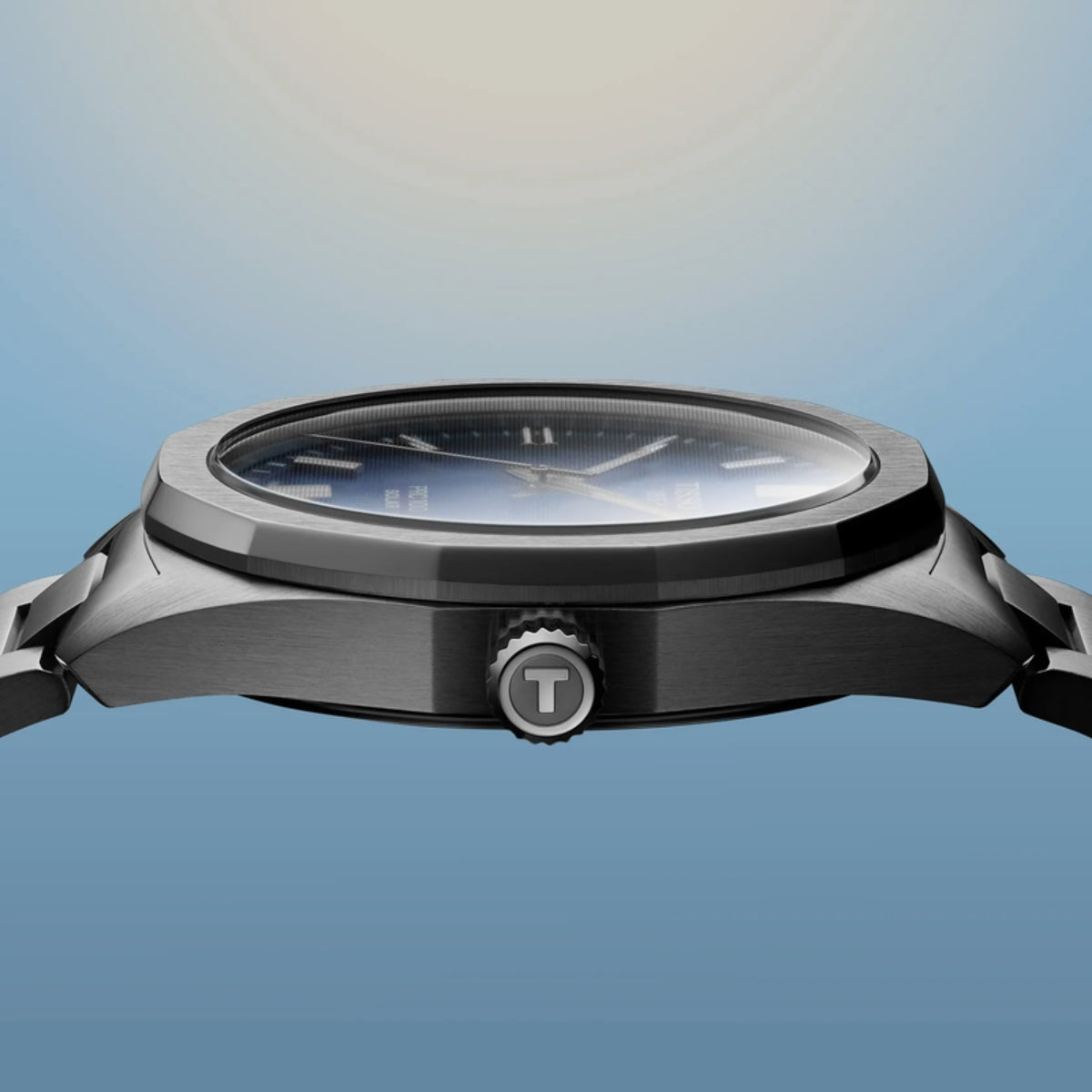 Watch with a metallic finish on a gradient blue background