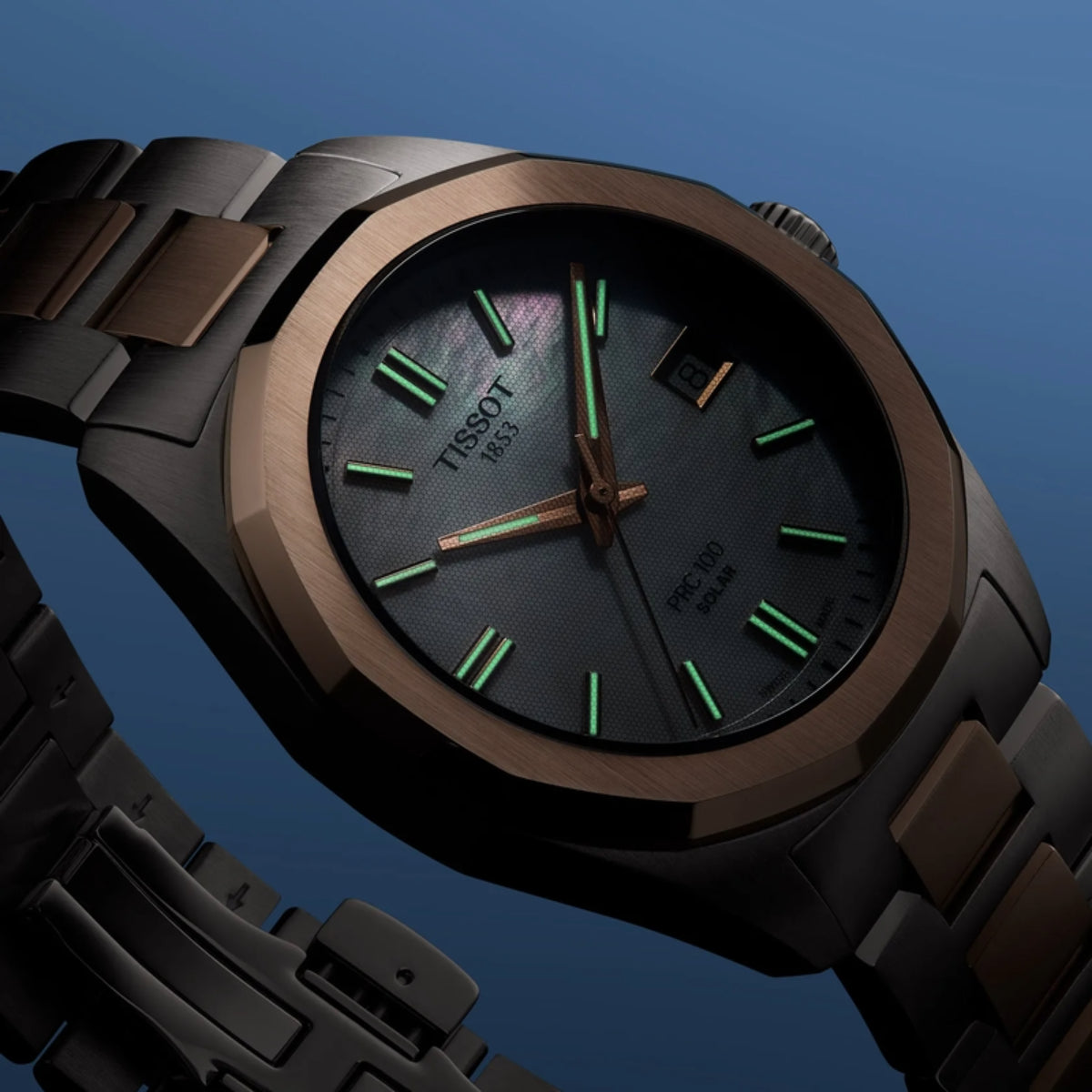 Tissot watch with brown strap and green accents on a blue background