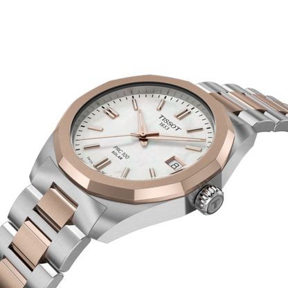 Tissot watch with silver and rose gold band on a white background