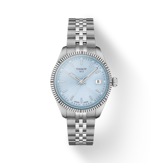 Silver Tissot watch with light blue dial on a white background