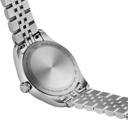Close-up of a silver Tissot watch band on a white background