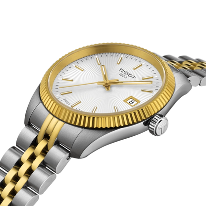 Two-tone Tissot watch with gold and silver band on a white background