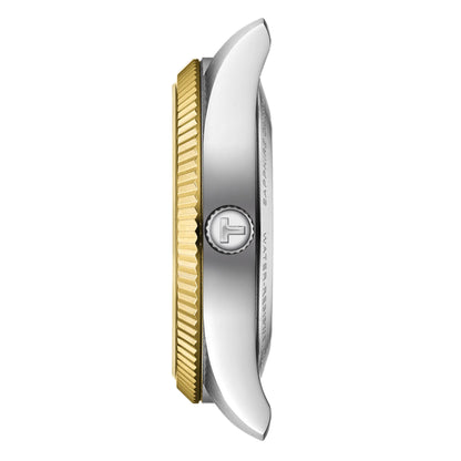 Watch with gold and silver case on a white background