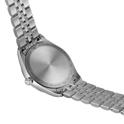 Close-up of a silver watch with a metal band on a white background