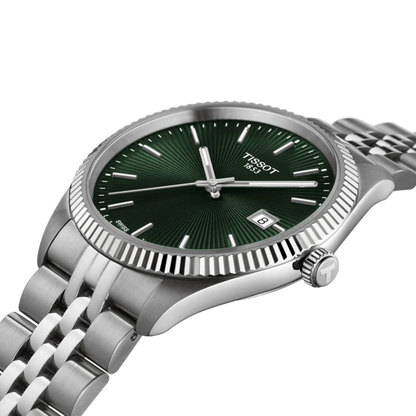Tissot watch with green dial and silver metal bracelet on a white background