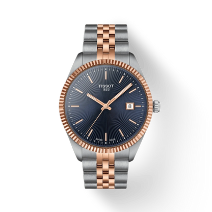 Tissot watch with rose gold and silver band on white background