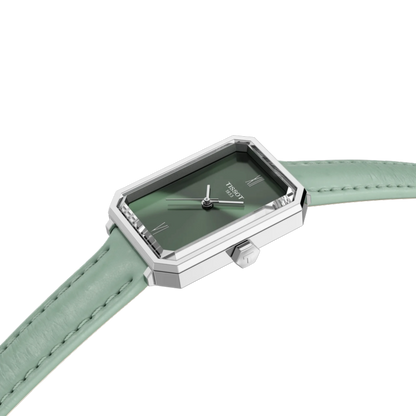 Watch with green strap and green face on a white background