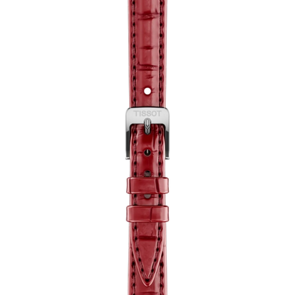 Red watch strap with silver Tissot logo on a white background