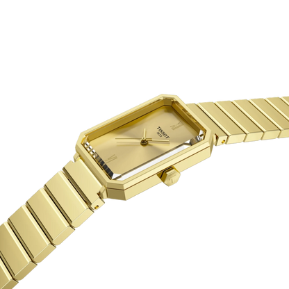 Gold watch with a rectangular face on a white background