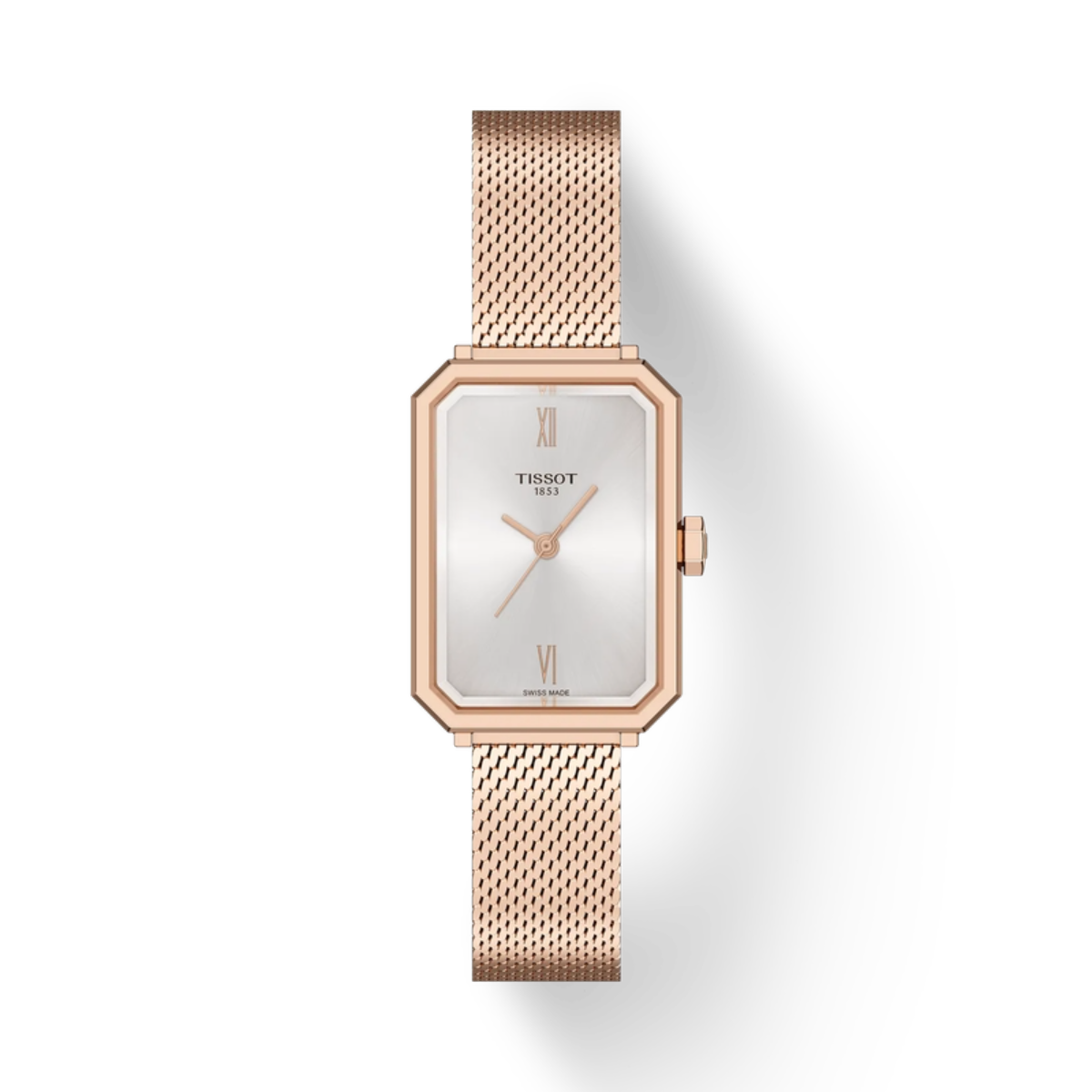 Rose gold Tissot watch with a white face on a light gray background