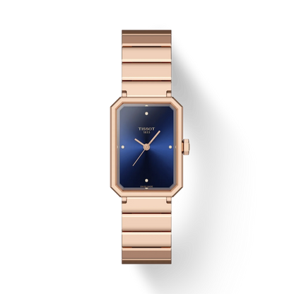 Rose gold watch with blue face on a white background