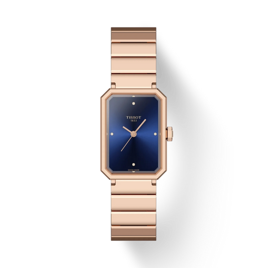 Rose gold watch with blue face on a white background