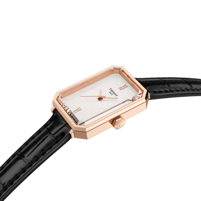 Watch with rose gold case and black strap on a white background