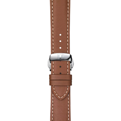 Brown leather watch strap with silver buckle on a white background