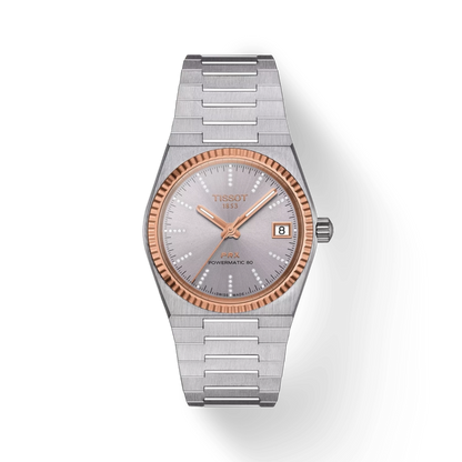 Silver and rose gold Tissot watch on a white background