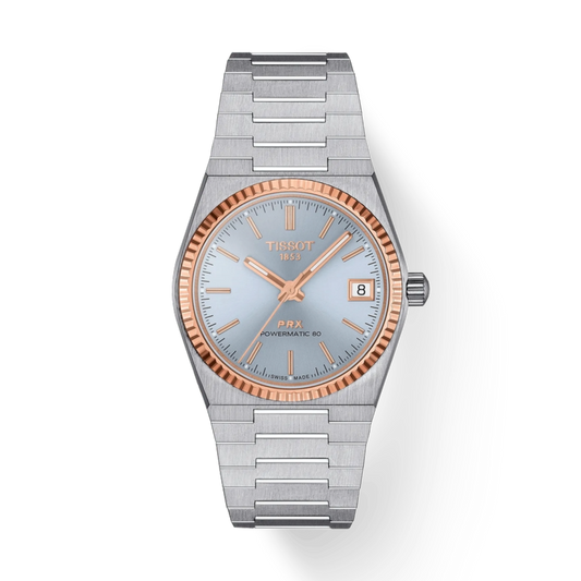 Silver and rose gold Tissot watch on a white background