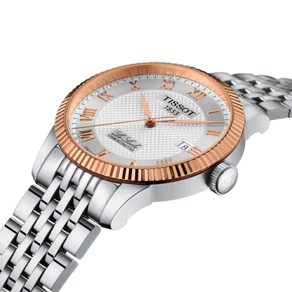 Tissot watch with rose gold and silver design on a white background