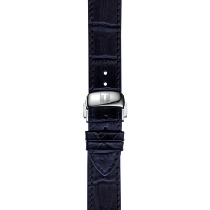 Navy blue crocodile-patterned watch strap with silver buckle on a white background