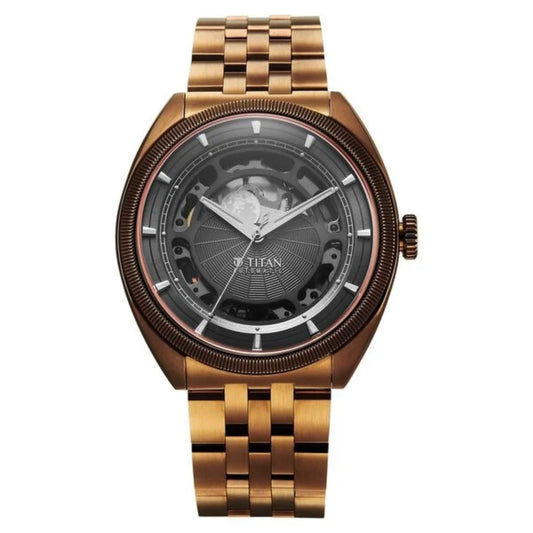Gold wristwatch with a detailed face on a white background