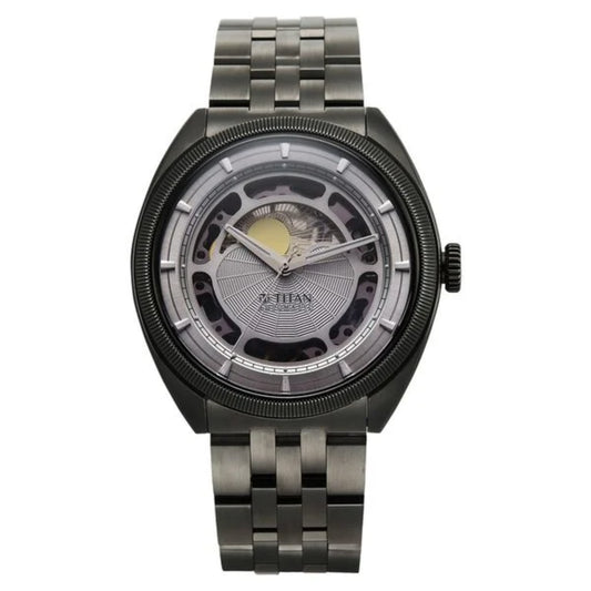 Titan watch with metallic band and detailed face on a white background