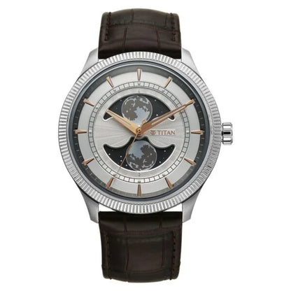 Titan watch with brown leather strap and silver case on white background
