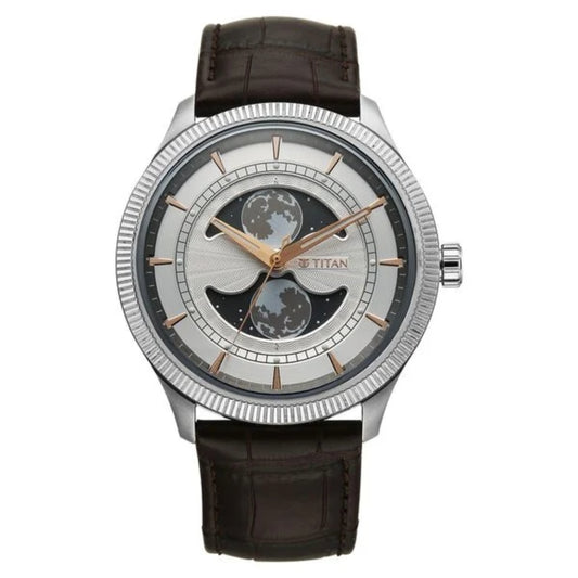 Titan watch with brown leather strap and silver case on white background