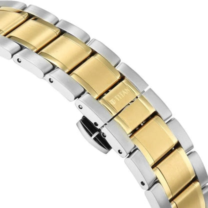 Two-tone gold and silver bracelet on a white background
