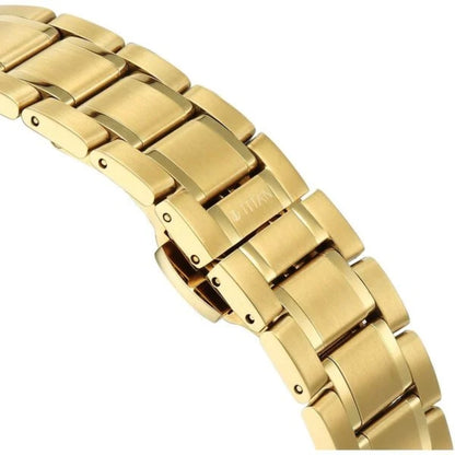 Gold metal bracelet on a white background