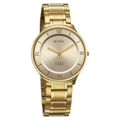 Gold wristwatch with a white face on a white background