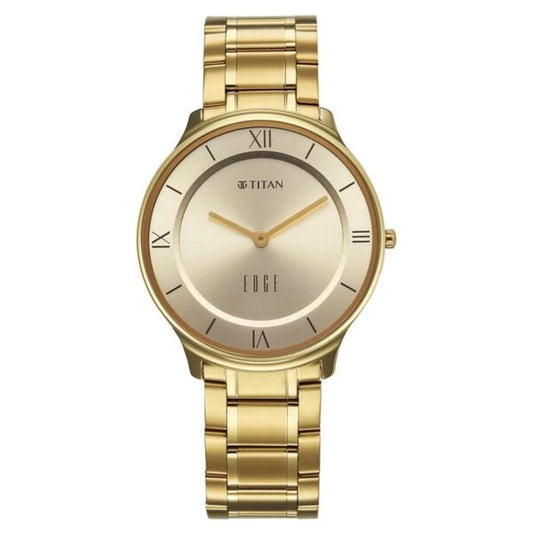 Gold wristwatch with visible Titan branding on a white background