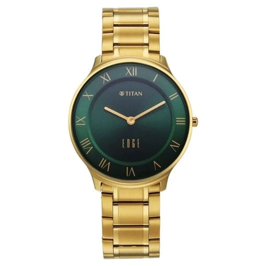 Gold watch with a green face on a white background