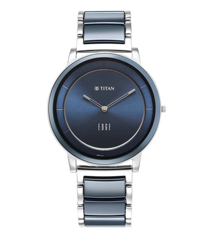A TITAN Edge Fusion analog watch for men with a blue dial and a silver stainless steel strap.