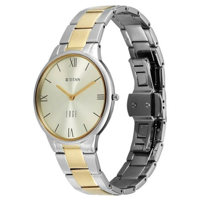 Two-tone Titan watch with gold and silver band on a white background