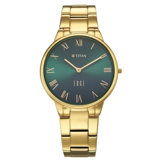 Gold watch with a green face on a white background