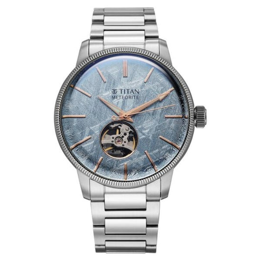 Titan watch with silver bracelet and blue face on a white background