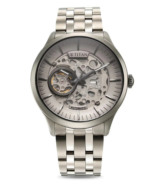 A TITAN Metal Mechanicals analog watch for men with a grey dial and a two-tone stainless steel bracelet.