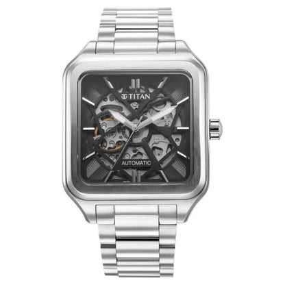 Titan watch with silver metal strap and transparent face on a white background