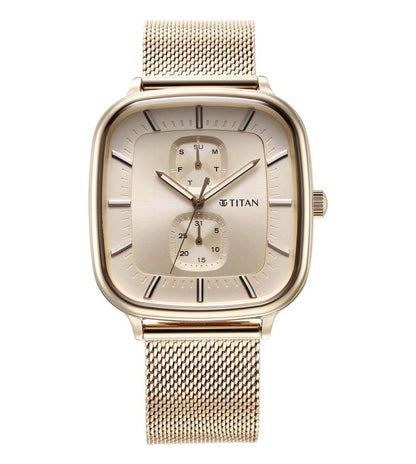 A TITAN Avant Garde II analog watch for men with a gold-colored metal band and case, featuring a beige dial.