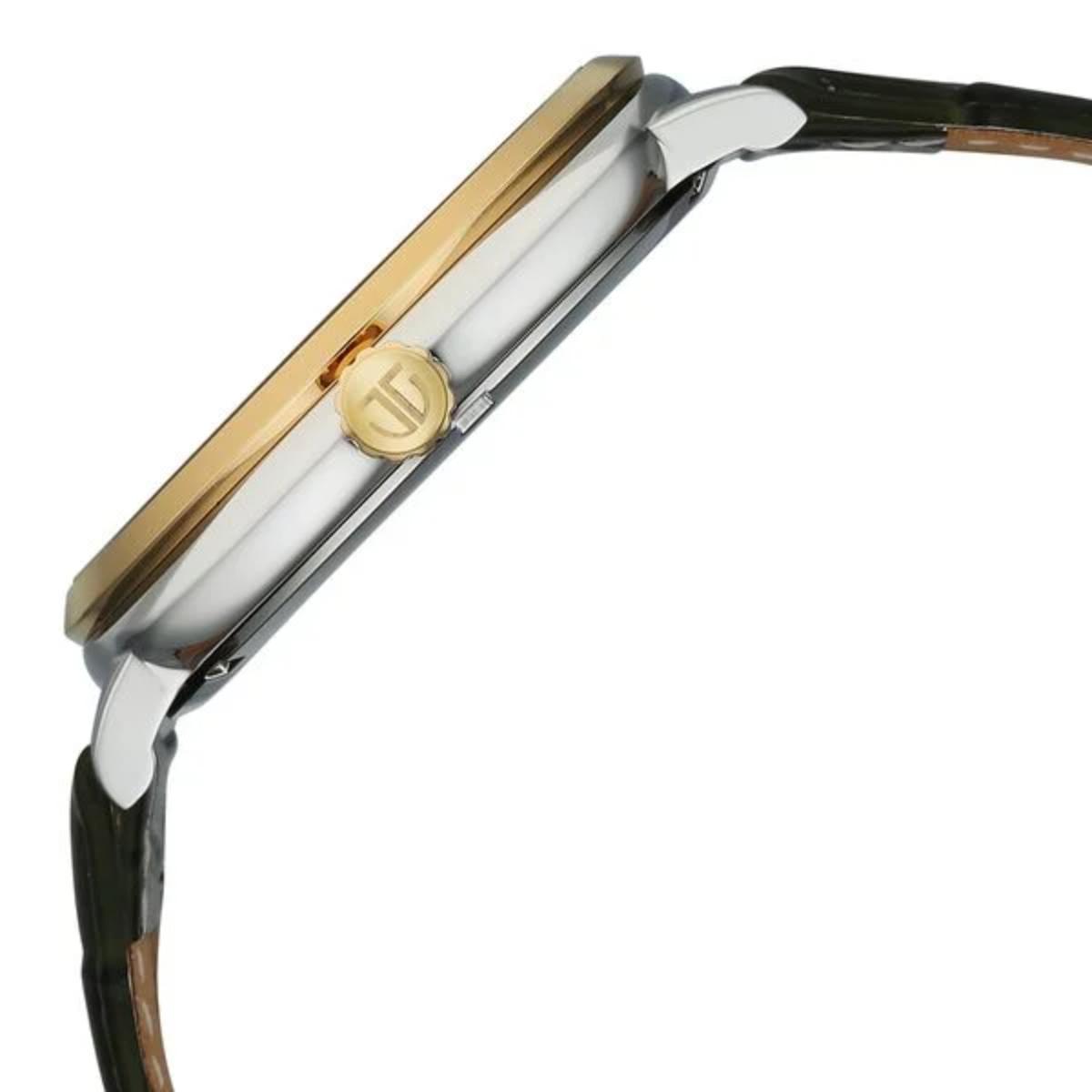 Close-up of a watch with gold and silver case on a white background