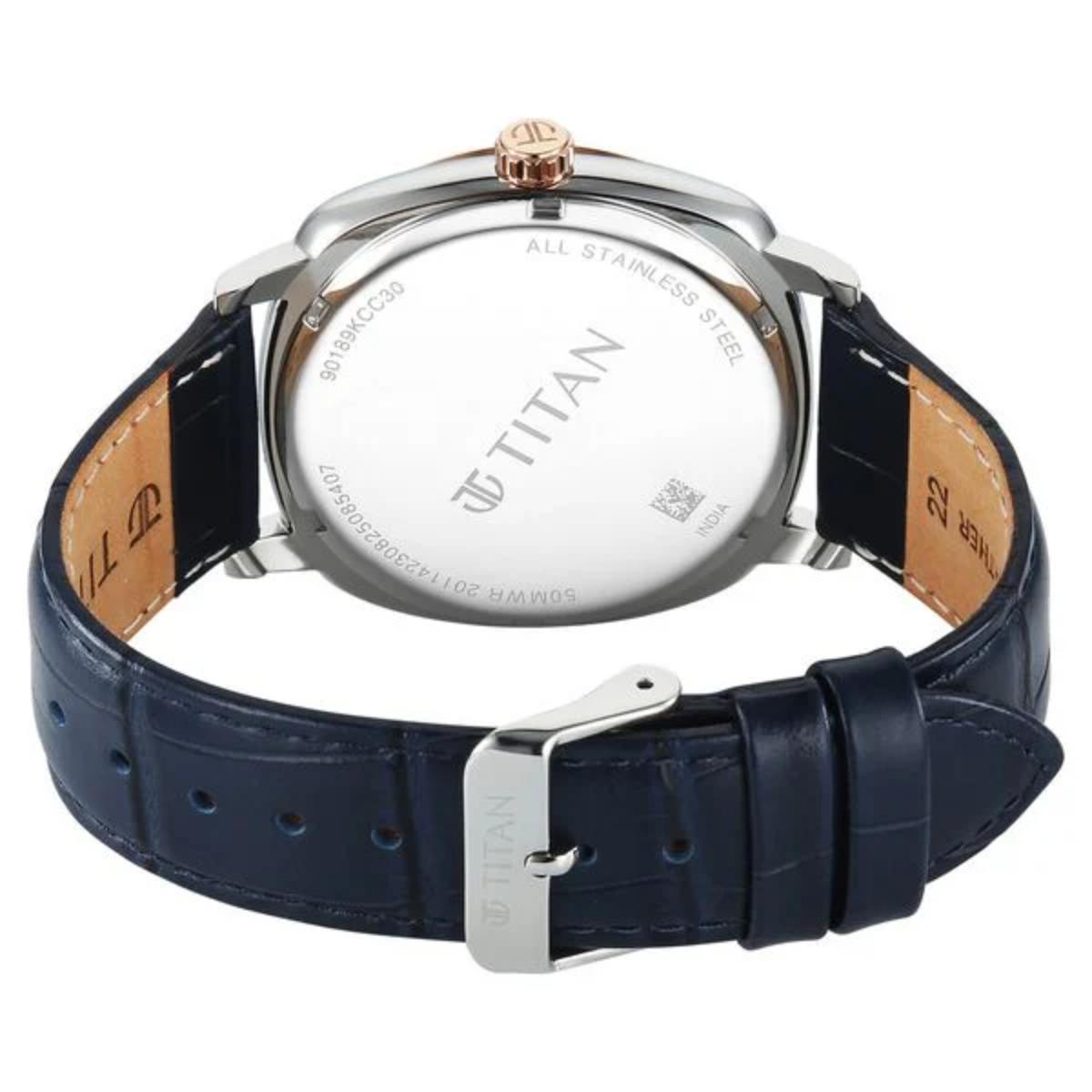 Titan watch with blue strap and silver case on a white background