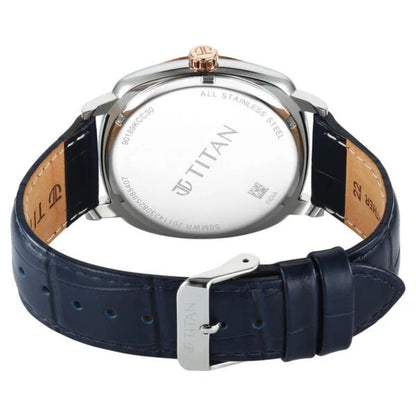 Titan watch with blue strap and silver case on a white background